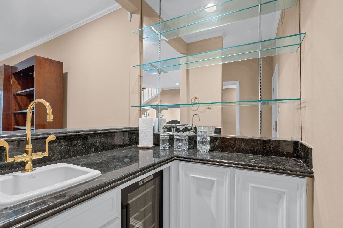 5084 Augusta Street Houston, TX 77007 - Photo 10 of 43 a bathroom with a double vanity sink and a mirror
