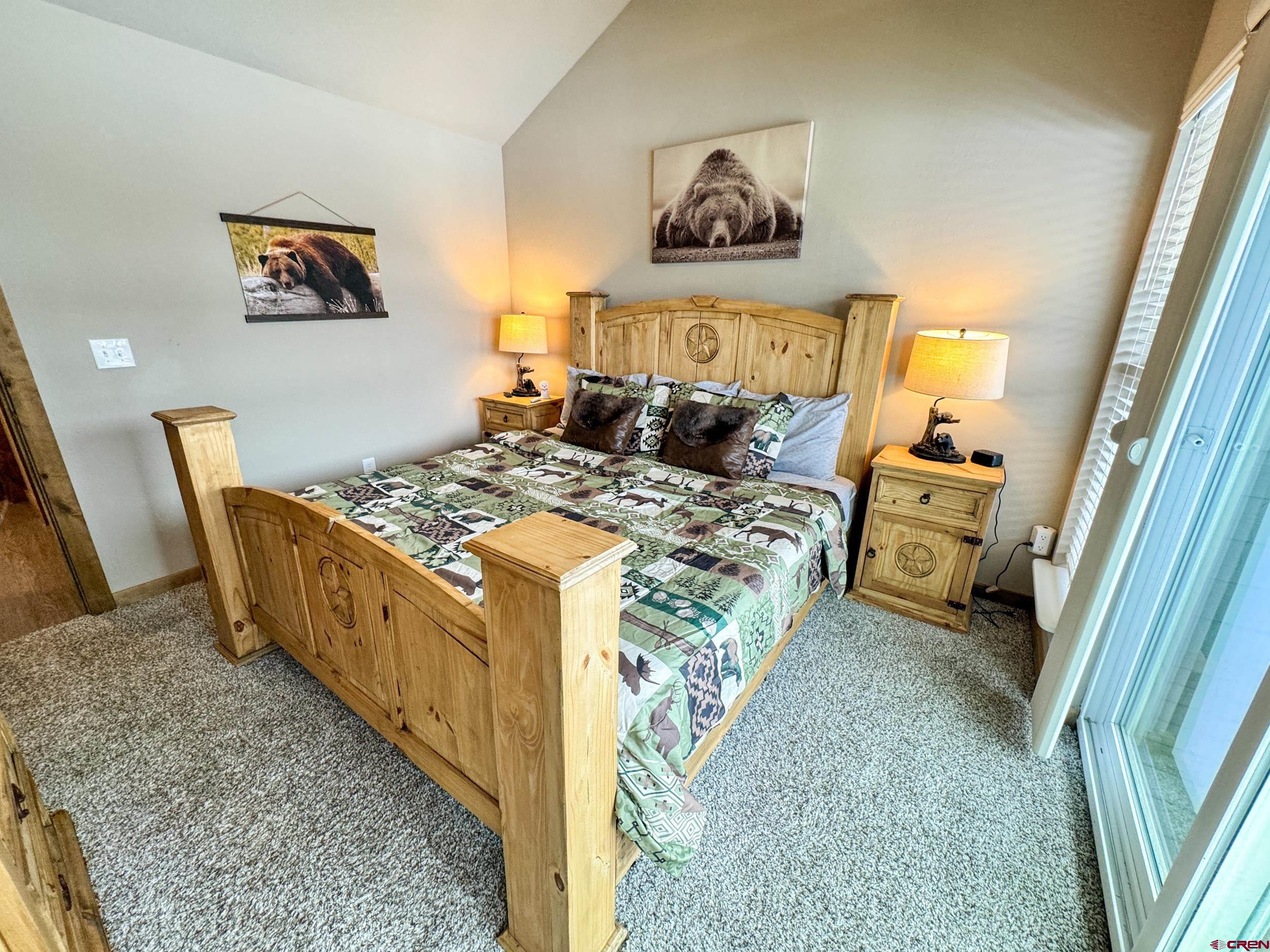 100 Teocalli Road, Unit 2 Crested Butte, CO 81224 - Photo 13 of 37 a bed room with a bed and a chair