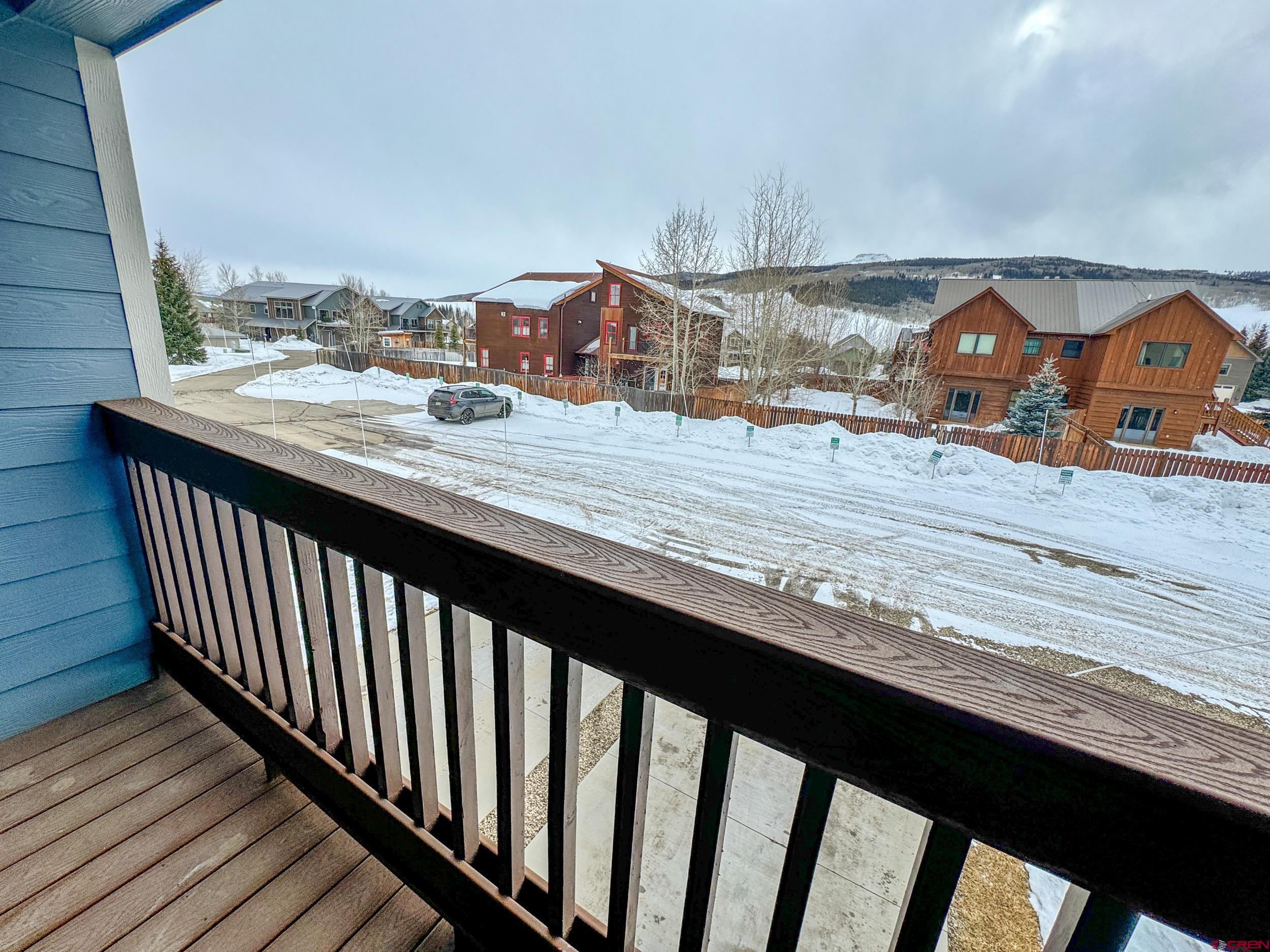 100 Teocalli Road, Unit 2 Crested Butte, CO 81224 - Photo 17 of 37 a view of a balcony with wooden benches