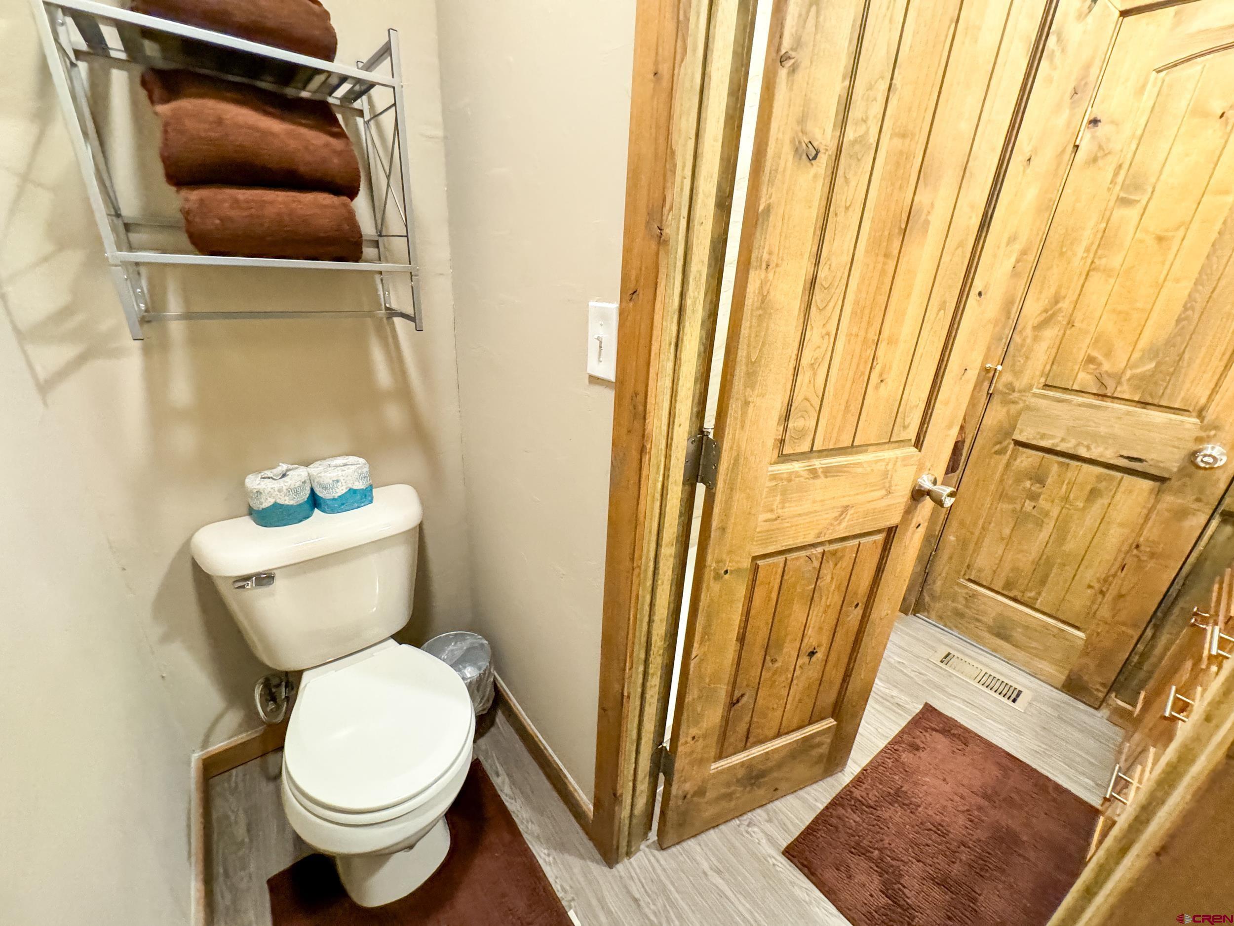 100 Teocalli Road, Unit 2 Crested Butte, CO 81224 - Photo 21 of 37 a bathroom with a toilet and a mirror