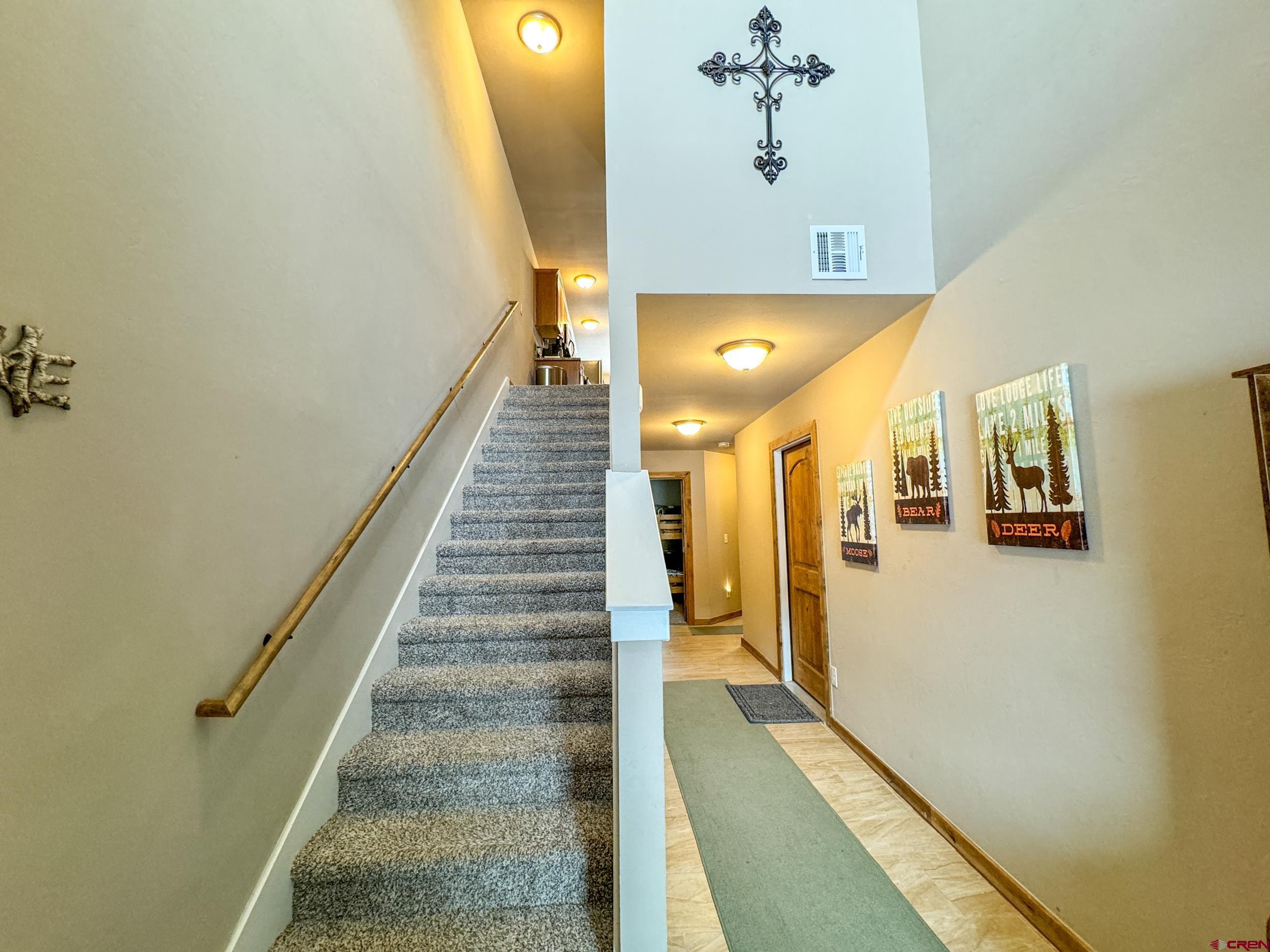100 Teocalli Road, Unit 2 Crested Butte, CO 81224 - Photo 22 of 37 a view of a hallway with wooden floor and staircase