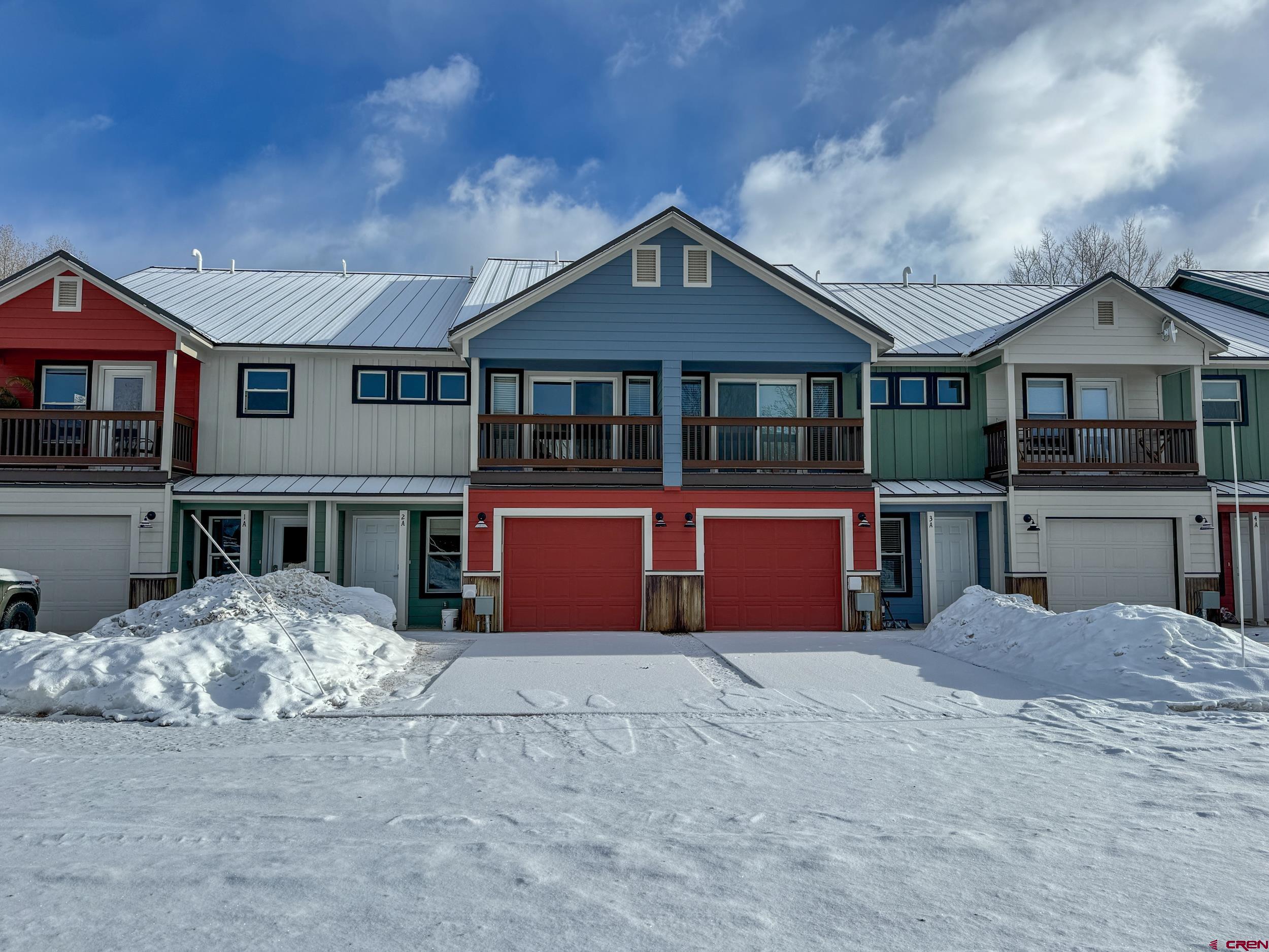 100 Teocalli Road, Unit 2 Crested Butte, CO 81224 - Photo 35 of 37 a front view of a house with a yard