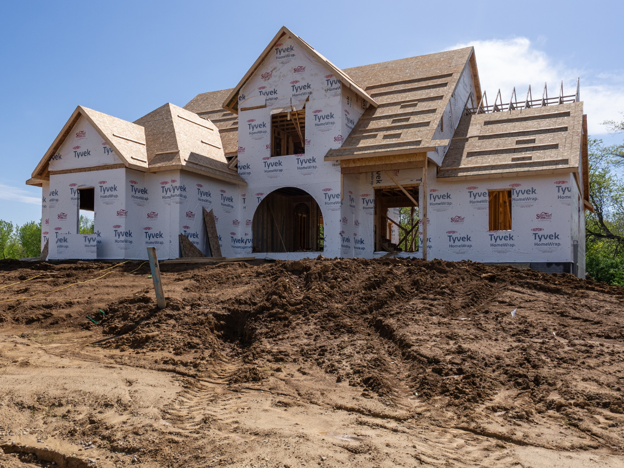 a front view of a house with a yard