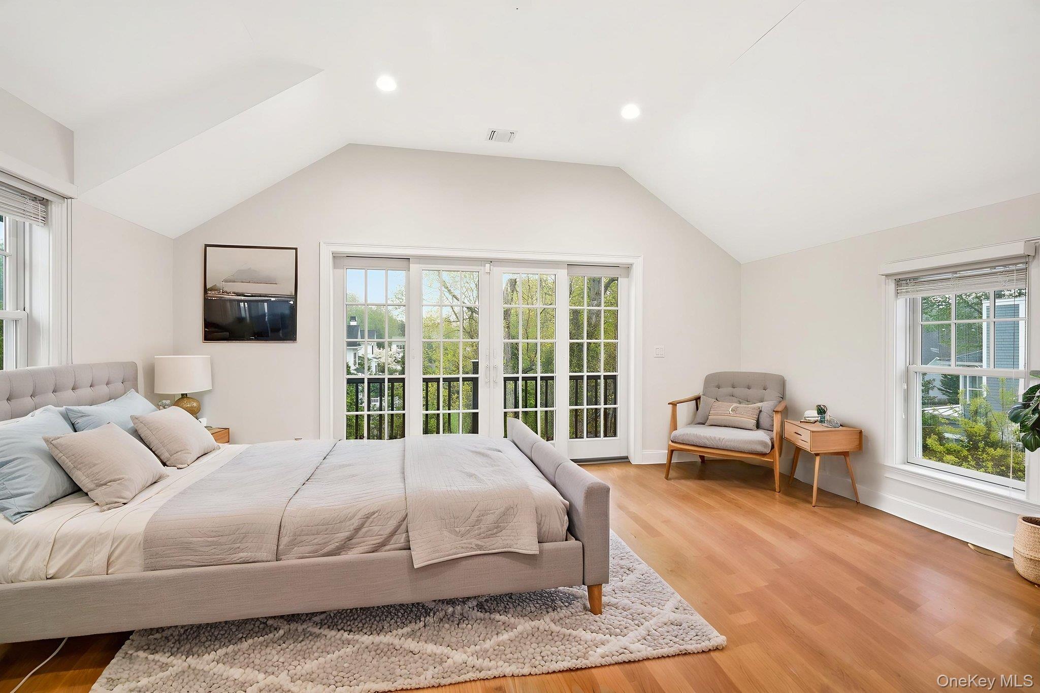 228 Central Avenue Rye, NY 10580 - Photo 11 of 24 a bedroom with a large bed and a window