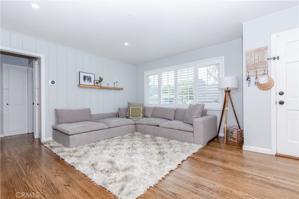 7734 Sycamore Avenue Riverside, CA 92504 - Photo 12 of 47 a living room with furniture and wooden floor
