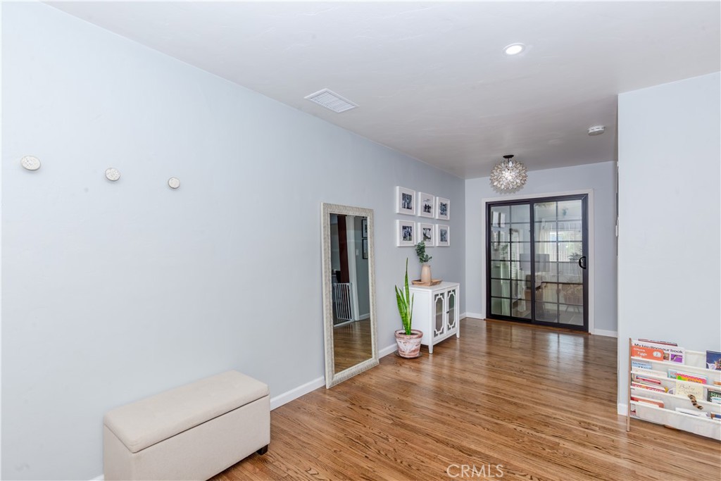 7734 Sycamore Avenue Riverside, CA 92504 - Photo 13 of 47 a living room with furniture and a wooden floor