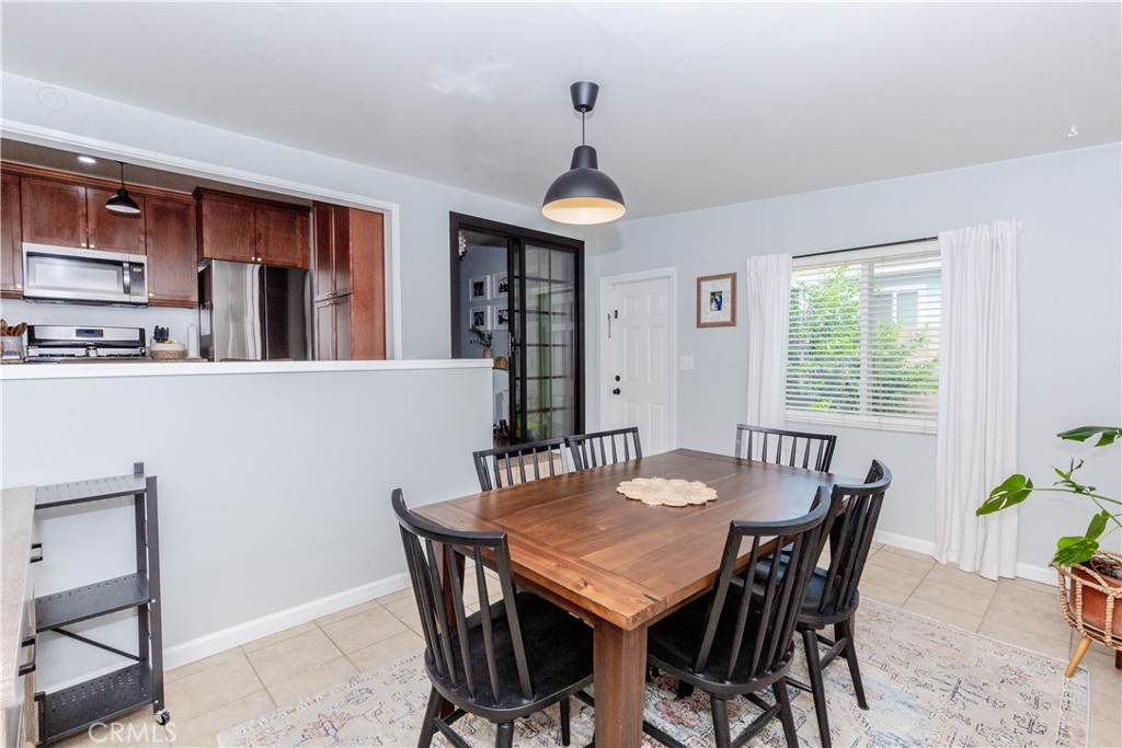 7734 Sycamore Avenue Riverside, CA 92504 - Photo 24 of 47 a view of a dining room with furniture