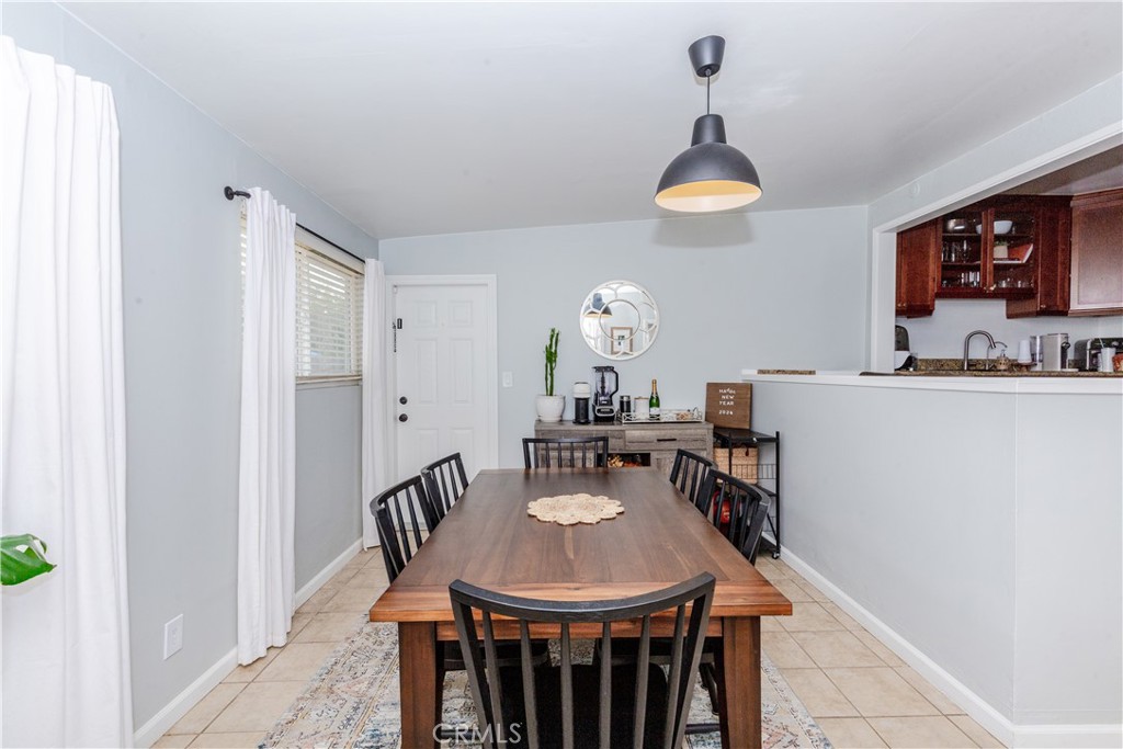 7734 Sycamore Avenue Riverside, CA 92504 - Photo 25 of 47 a view of a dining room with furniture