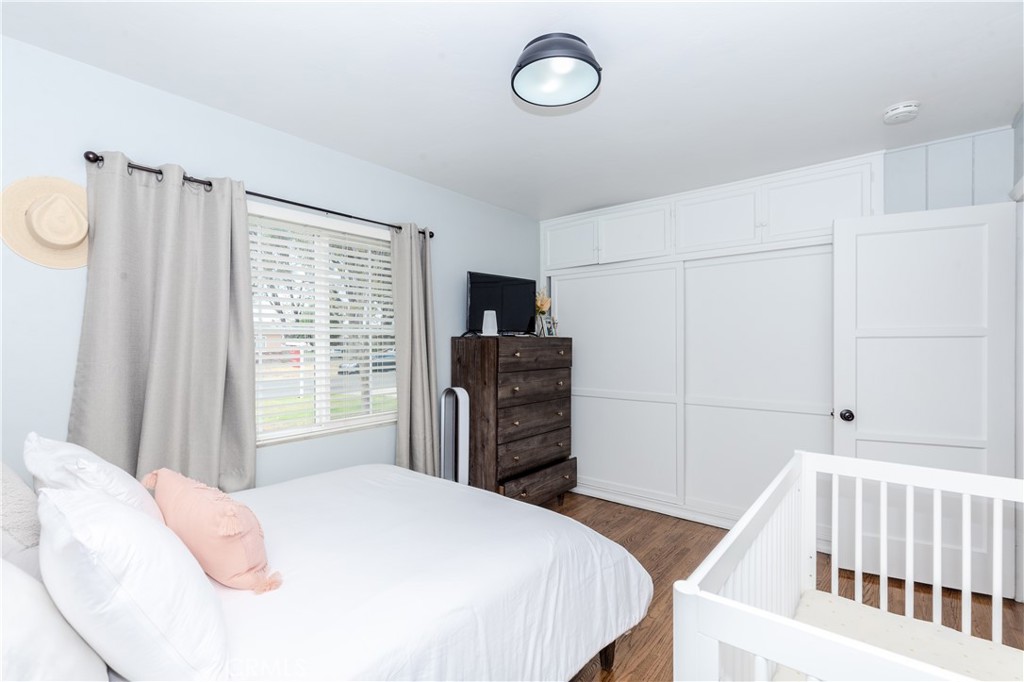 7734 Sycamore Avenue Riverside, CA 92504 - Photo 28 of 47 a bedroom with a bed and a television