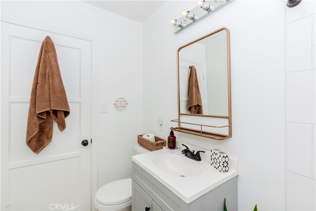 7734 Sycamore Avenue Riverside, CA 92504 - Photo 31 of 47 a bathroom with a sink toilet and vanity