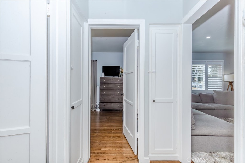 7734 Sycamore Avenue Riverside, CA 92504 - Photo 32 of 47 a view of a hallway with a wooden floor