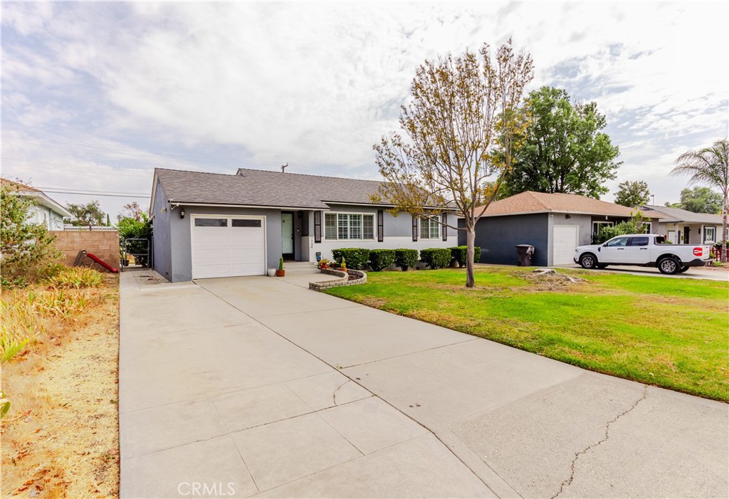 7734 Sycamore Avenue Riverside, CA 92504 - Photo 4 of 47 a front view of a building with garden