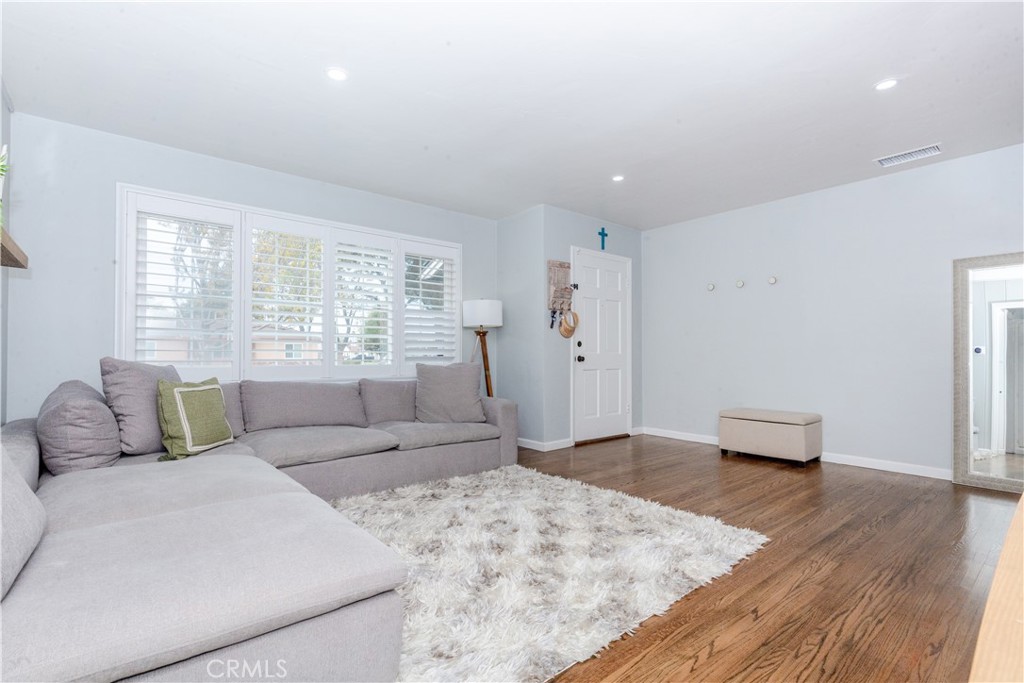 7734 Sycamore Avenue Riverside, CA 92504 - Photo 10 of 47 a living room with furniture and a large window