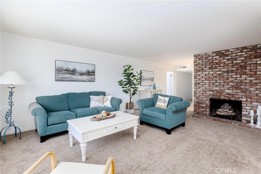 101 Java Street Morro Bay, CA 93442 - Photo 23 of 29 a living room with furniture and a fireplace