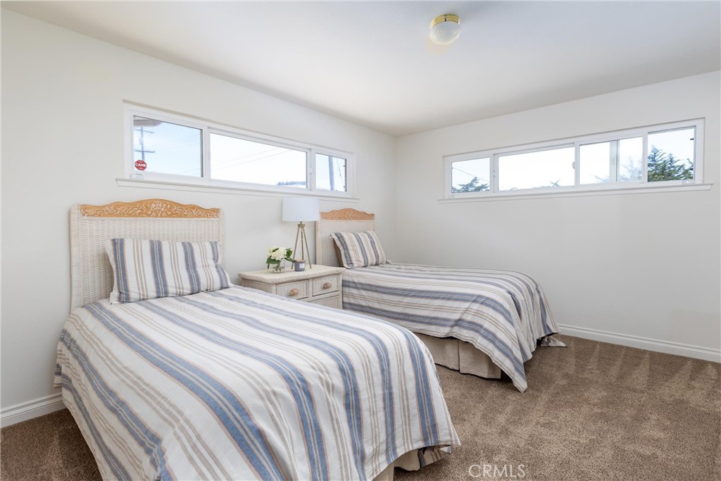 101 Java Street Morro Bay, CA 93442 - Photo 27 of 29 a bedroom with a bed and window