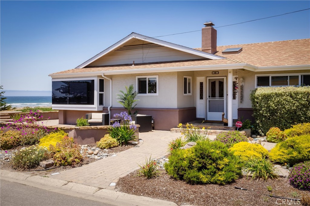 101 Java Street Morro Bay, CA 93442 - Photo 3 of 29 a front view of a house with a yard