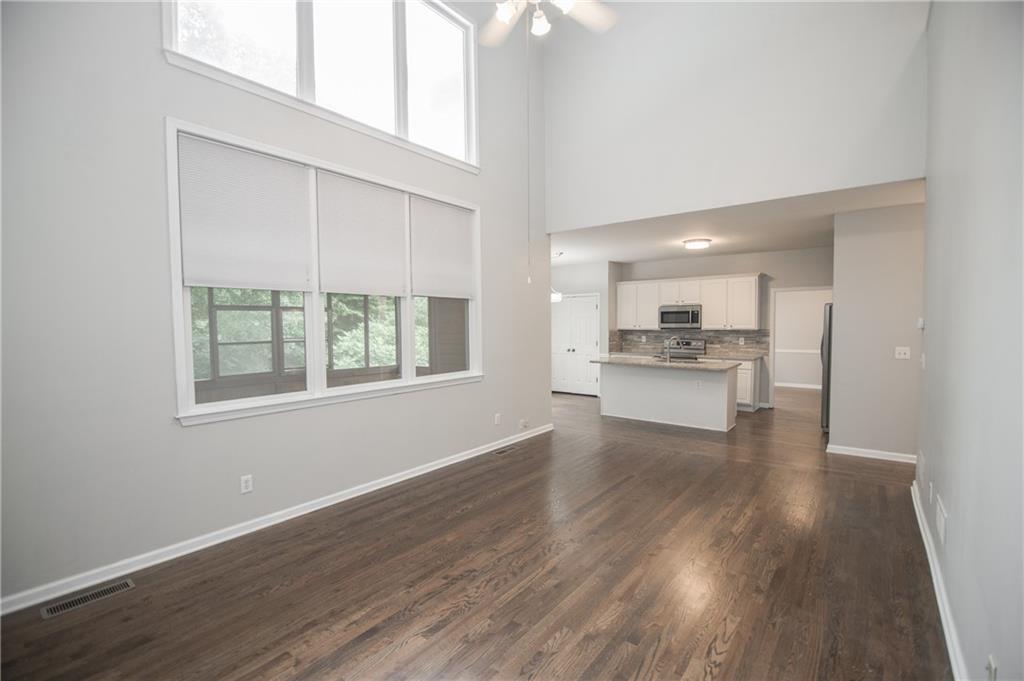 755 Sheridan Ridge Court Alpharetta, GA 30022 - Photo 18 of 57 a view of kitchen with wooden floor electronic appliances and window