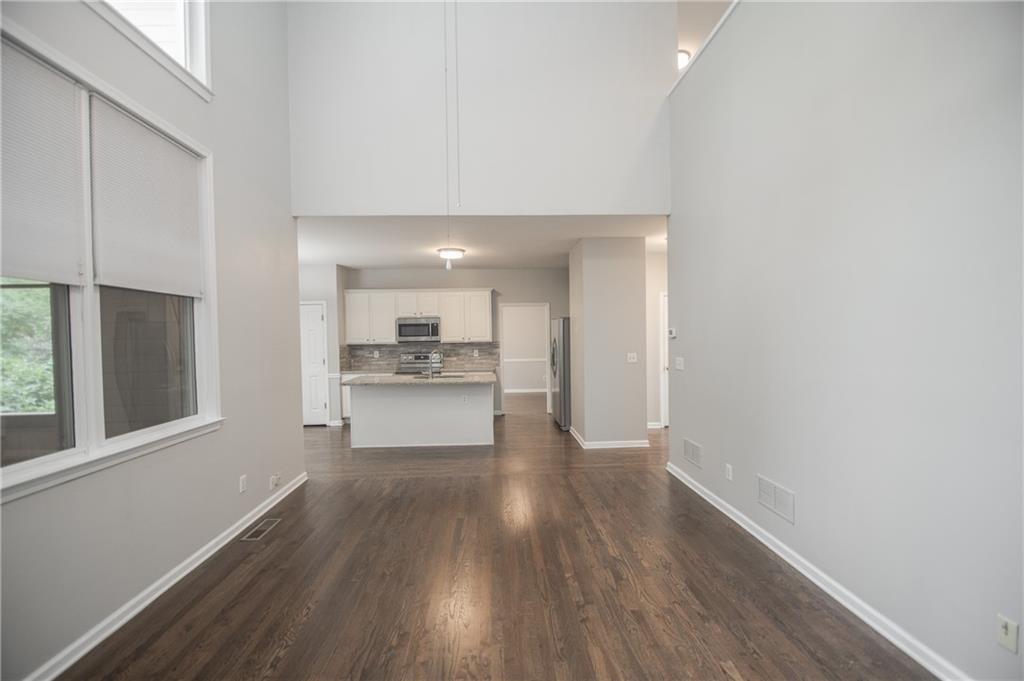 755 Sheridan Ridge Court Alpharetta, GA 30022 - Photo 20 of 57 a view of a kitchen with wooden floor and a window