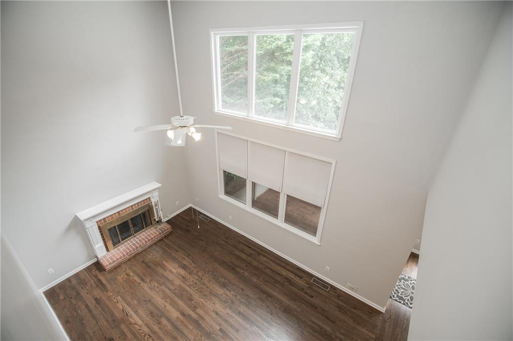 755 Sheridan Ridge Court Alpharetta, GA 30022 - Photo 21 of 57 a view of an empty room with wooden floor and a window