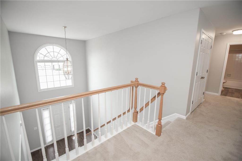 755 Sheridan Ridge Court Alpharetta, GA 30022 - Photo 23 of 57 a view of a hallway with windows