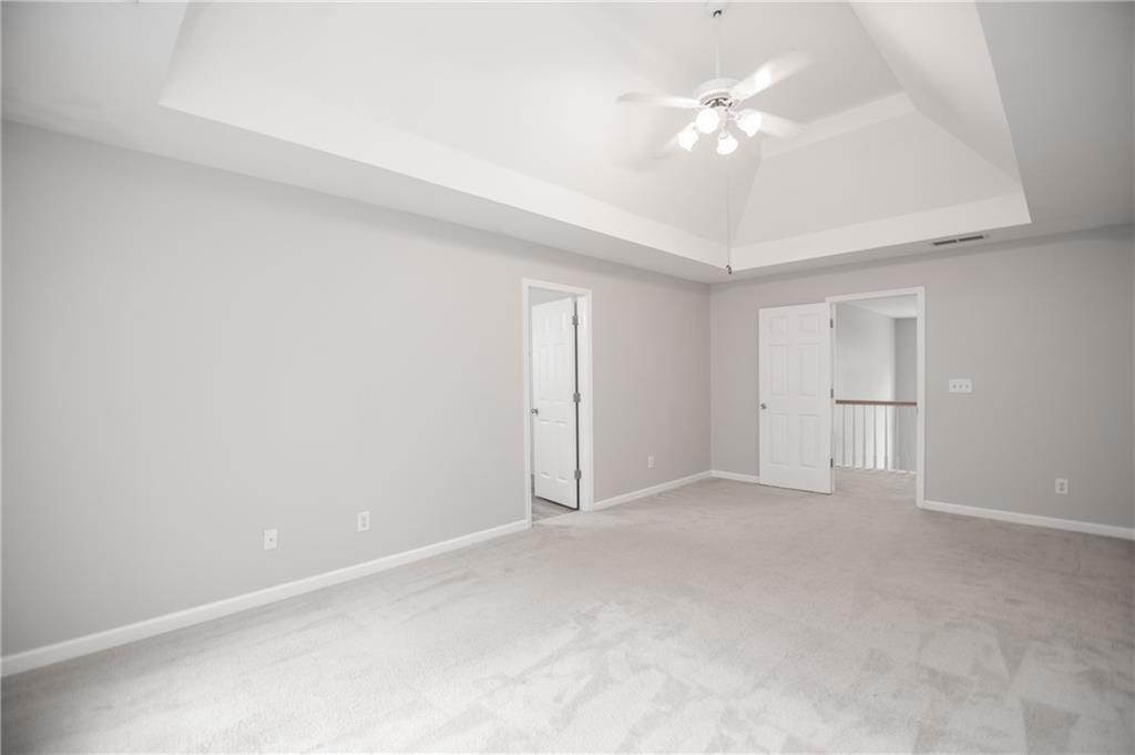 755 Sheridan Ridge Court Alpharetta, GA 30022 - Photo 29 of 57 a view of an empty room with a ceiling fan