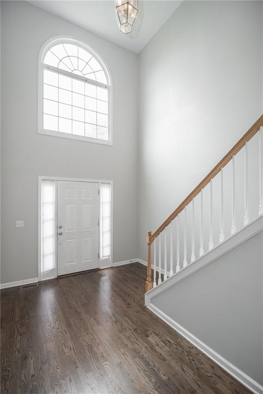 755 Sheridan Ridge Court Alpharetta, GA 30022 - Photo 3 of 57 an empty room with wooden floor windows and windows