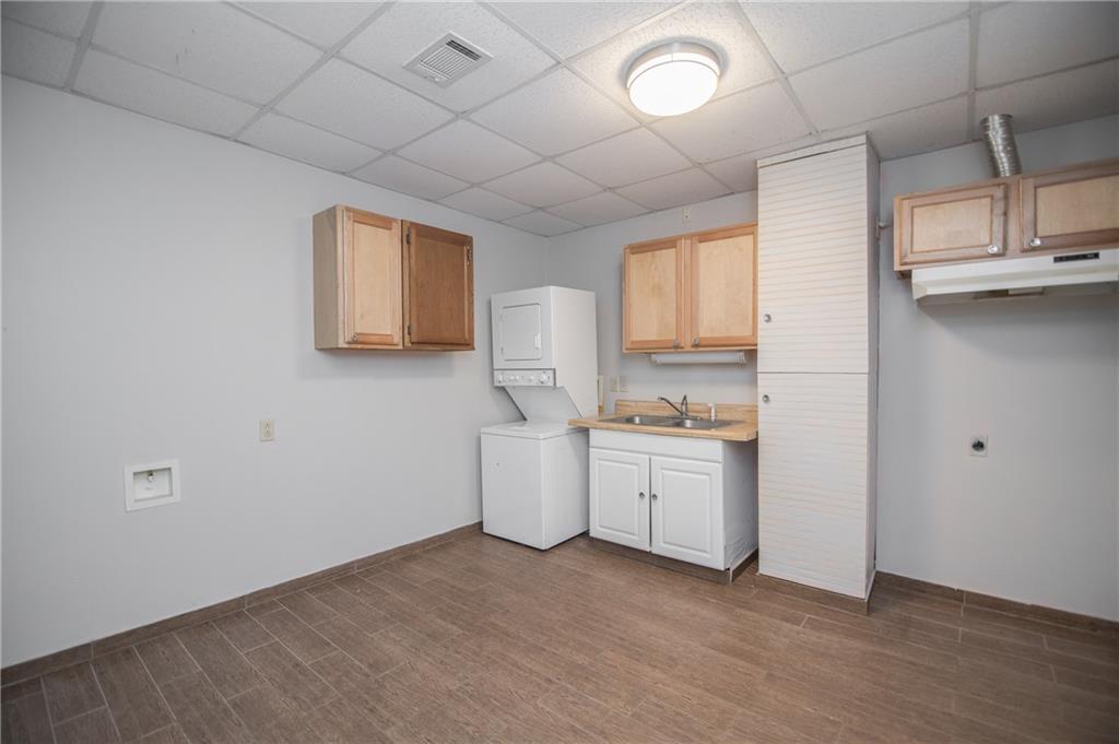 755 Sheridan Ridge Court Alpharetta, GA 30022 - Photo 39 of 57 a room with a stove and a dishwasher