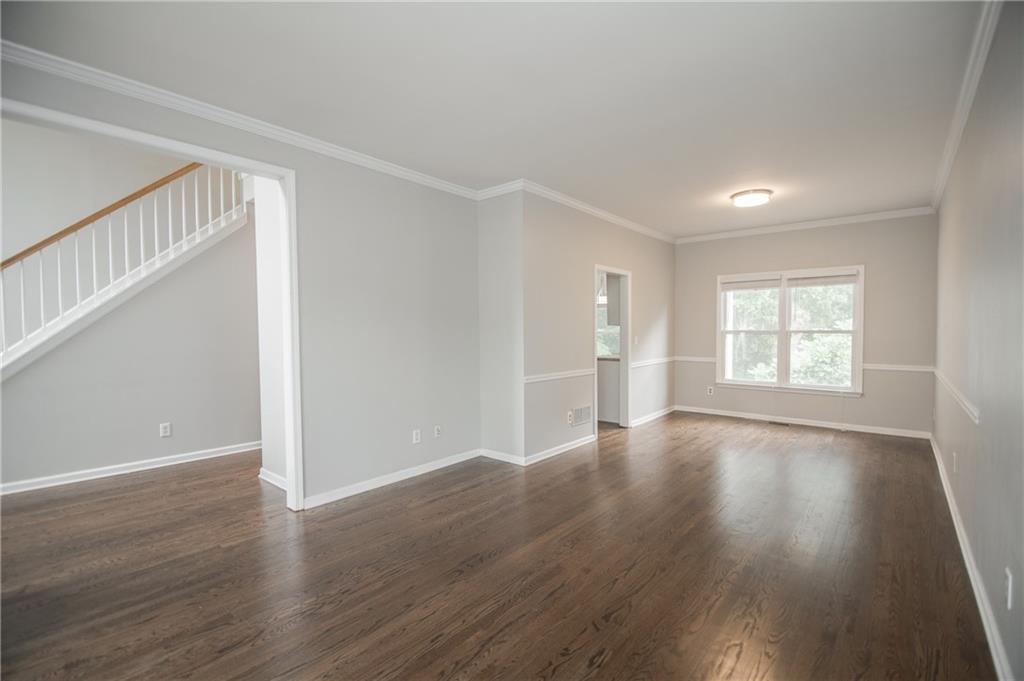 755 Sheridan Ridge Court Alpharetta, GA 30022 - Photo 7 of 57 a view of an empty room with wooden floor and window