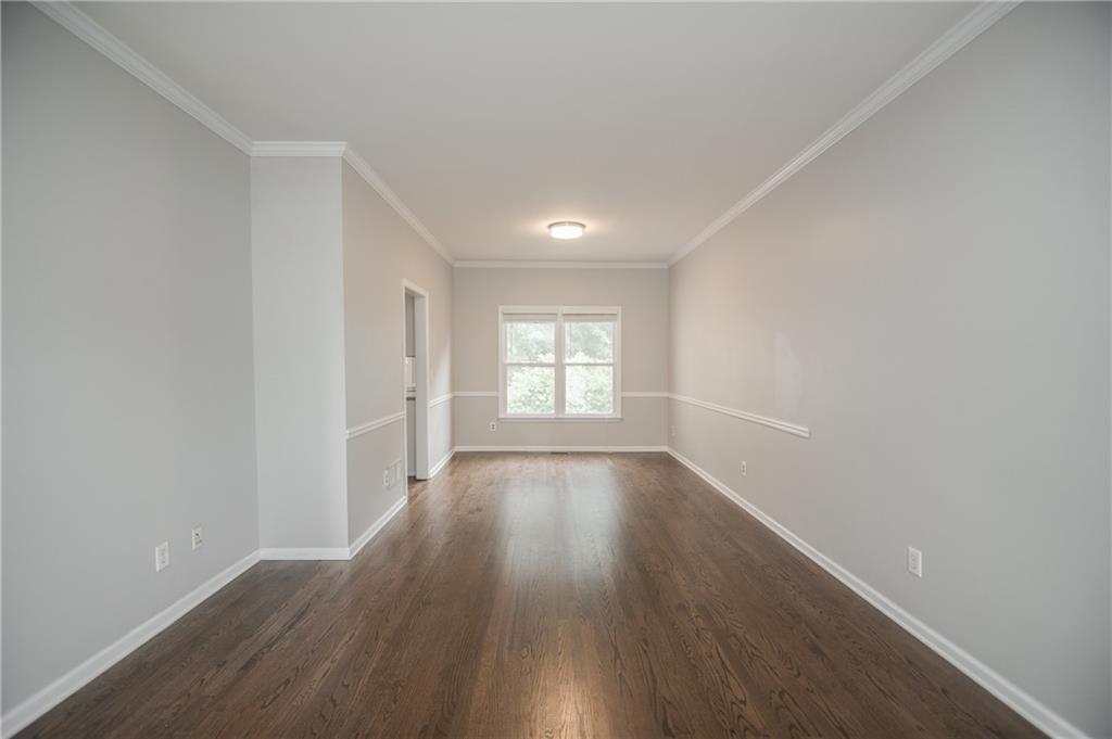 755 Sheridan Ridge Court Alpharetta, GA 30022 - Photo 8 of 57 wooden floor in an empty room with a window