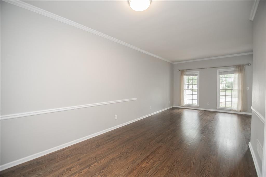 755 Sheridan Ridge Court Alpharetta, GA 30022 - Photo 10 of 57 a view of an empty room with wooden floor and window
