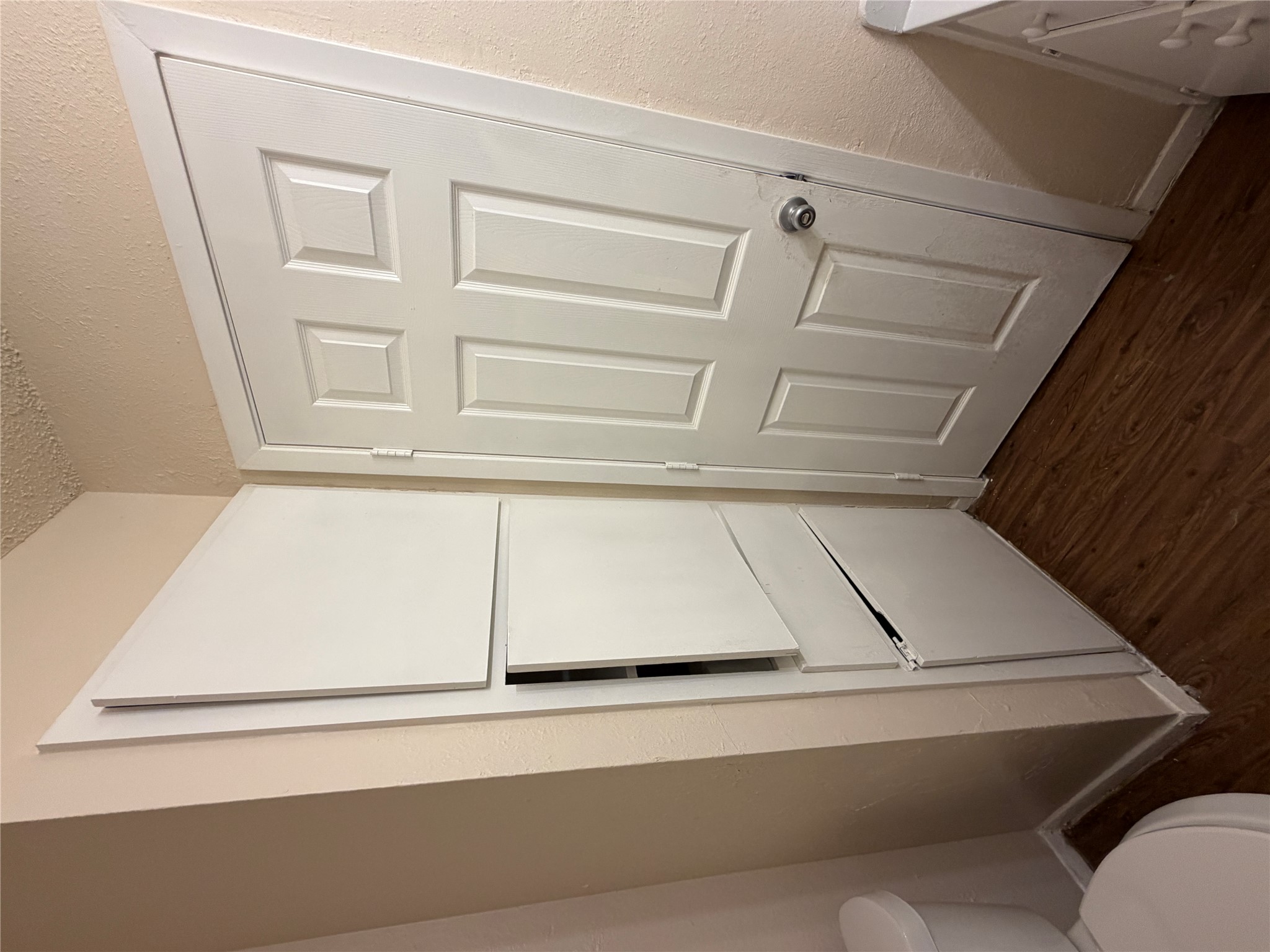 4702 Rocking Chair Road Austin, TX 78744 - Photo 12 of 28 Bathroom featuring dark wood-type flooring, a textured wall, and vanity