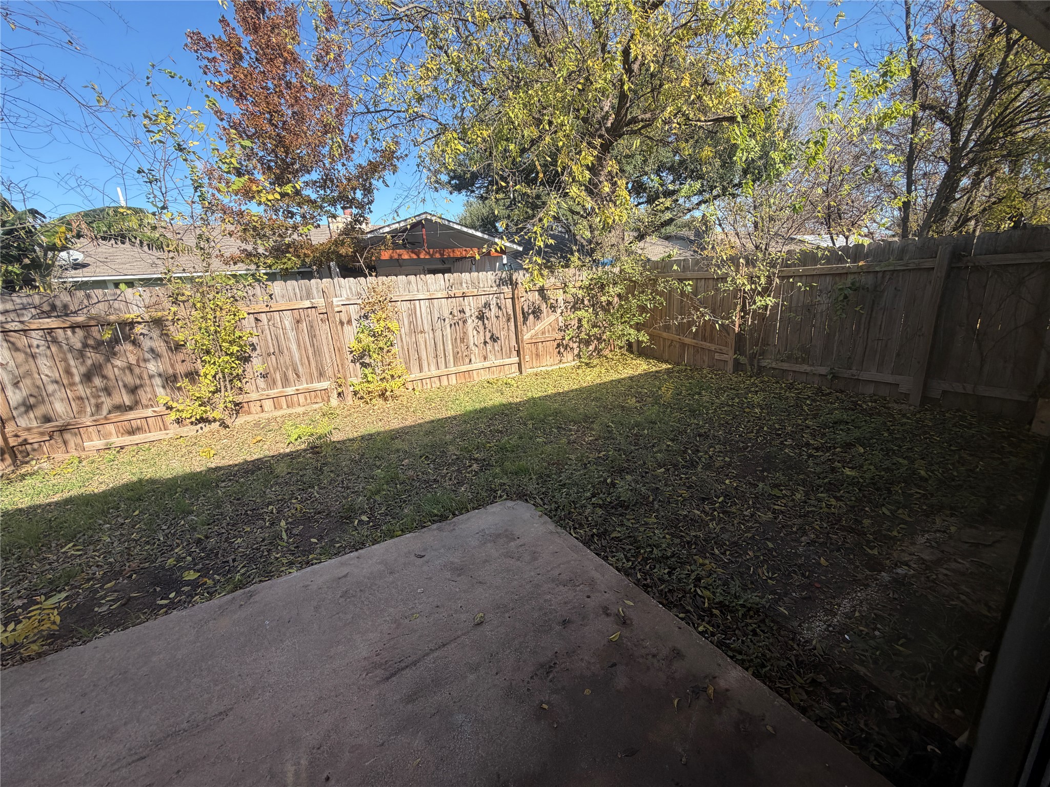 4702 Rocking Chair Road Austin, TX 78744 - Photo 15 of 28 Fenced backyard featuring a patio