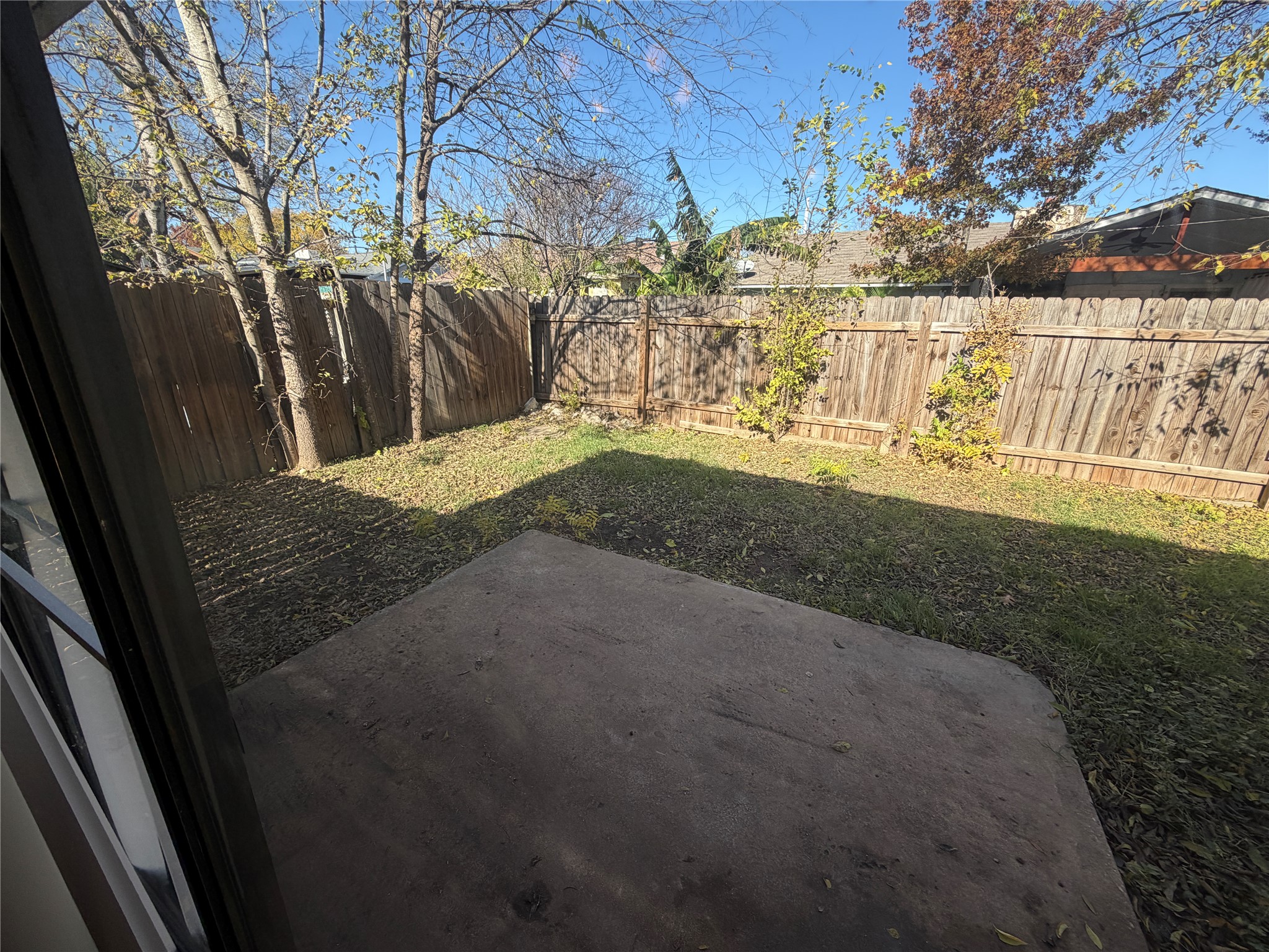 4702 Rocking Chair Road Austin, TX 78744 - Photo 16 of 28 Fenced backyard with a patio
