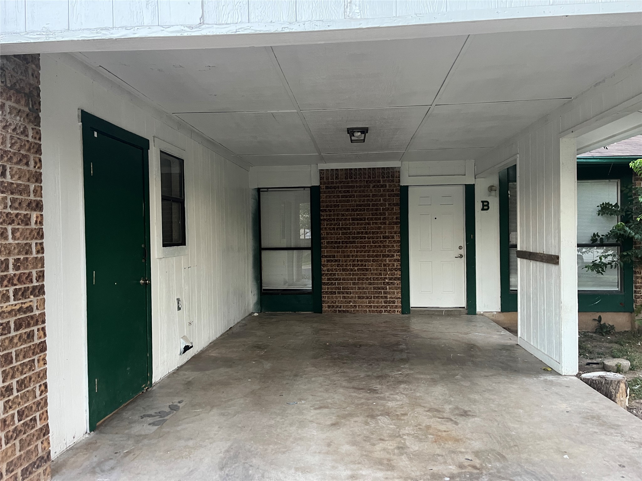4702 Rocking Chair Road Austin, TX 78744 - Photo 18 of 28 Covered porch featuring an attached carport