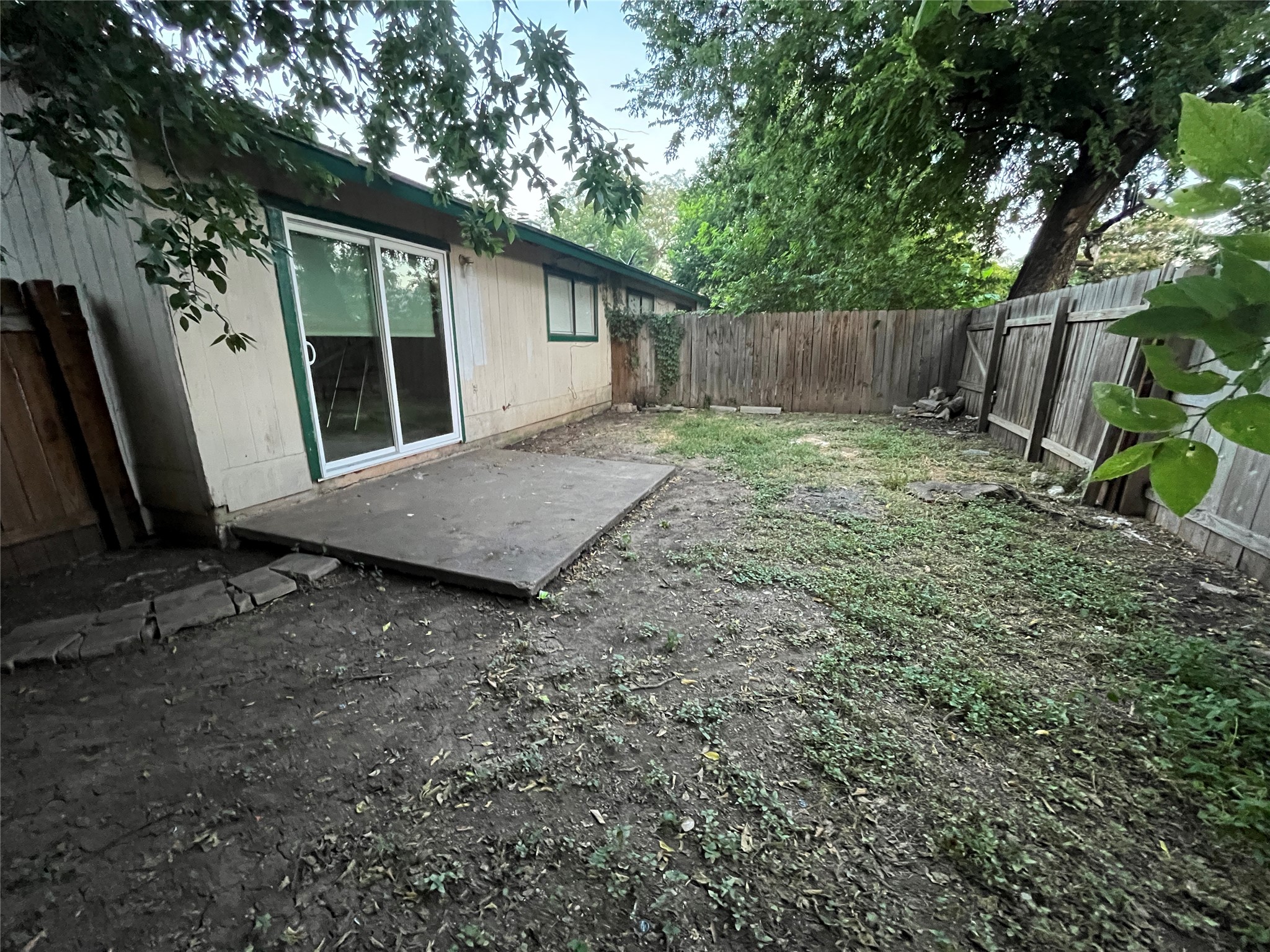 4702 Rocking Chair Road Austin, TX 78744 - Photo 21 of 28 Fenced backyard with a patio area