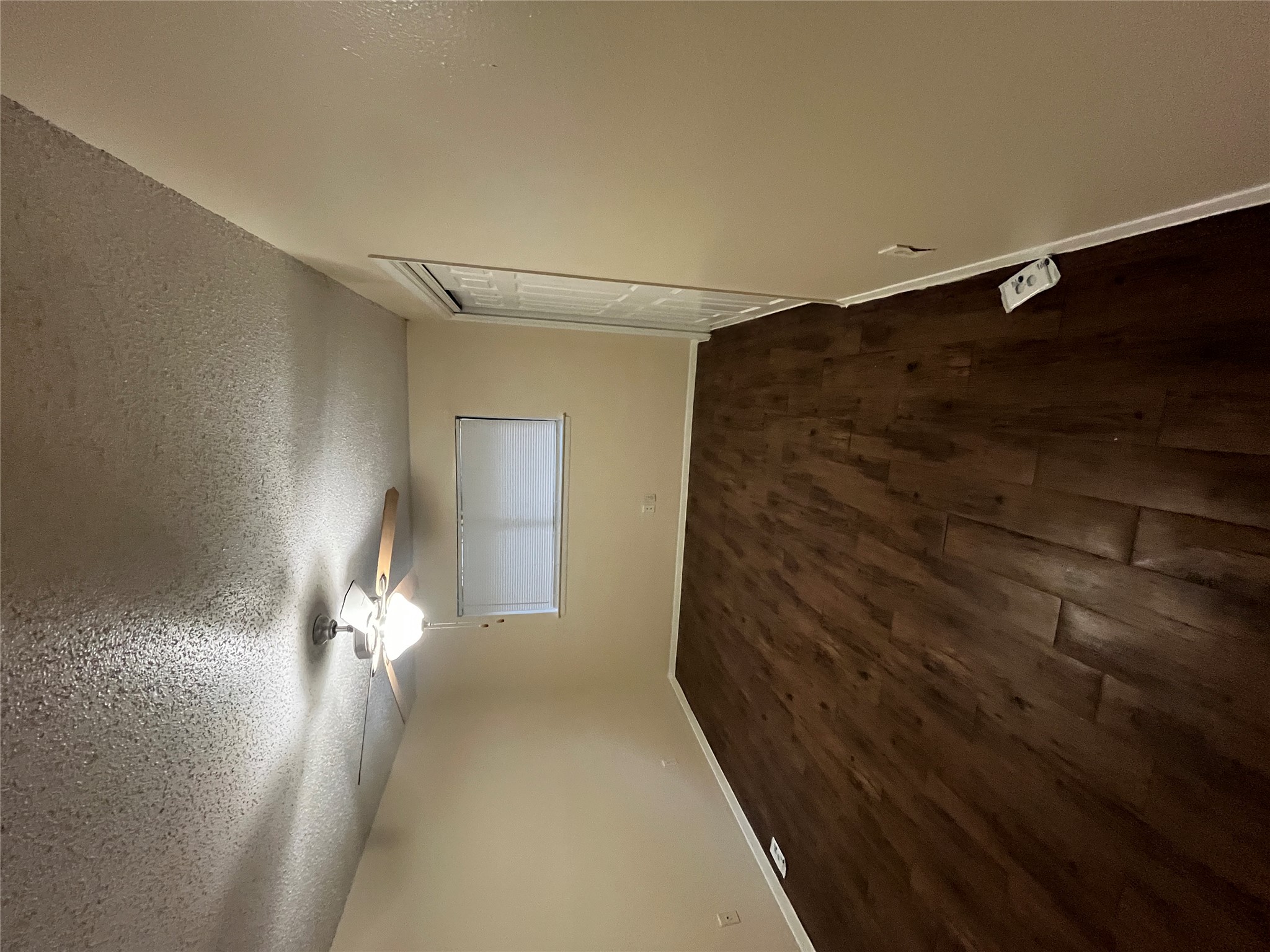 4702 Rocking Chair Road Austin, TX 78744 - Photo 26 of 28 Unfurnished bedroom with dark wood-style flooring, a textured ceiling, a closet, and ceiling fan
