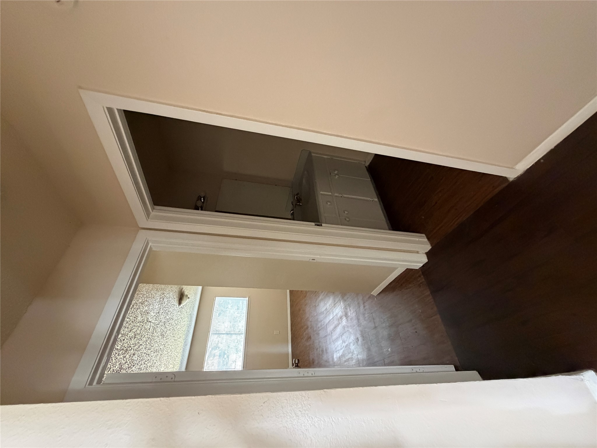 4702 Rocking Chair Road Austin, TX 78744 - Photo 10 of 28 Hall featuring baseboards and dark wood-type flooring