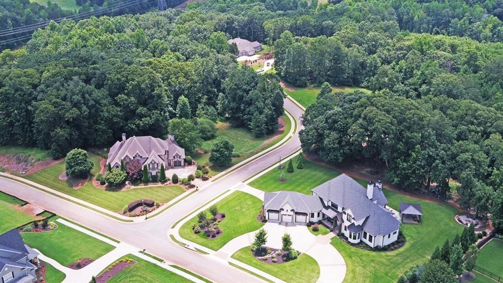 5420 Planting Field Lane Flowery Branch, GA 30542 - Photo 1 of 4 an aerial view of a house a garden and mountain view