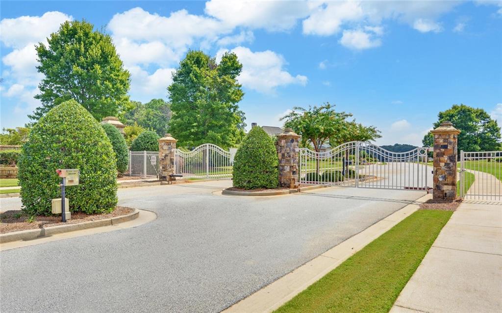 5420 Planting Field Lane Flowery Branch, GA 30542 - Photo 4 of 4 a view of a street with a building in the background