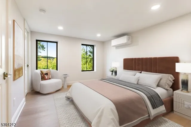 a bedroom with a bed and a couch