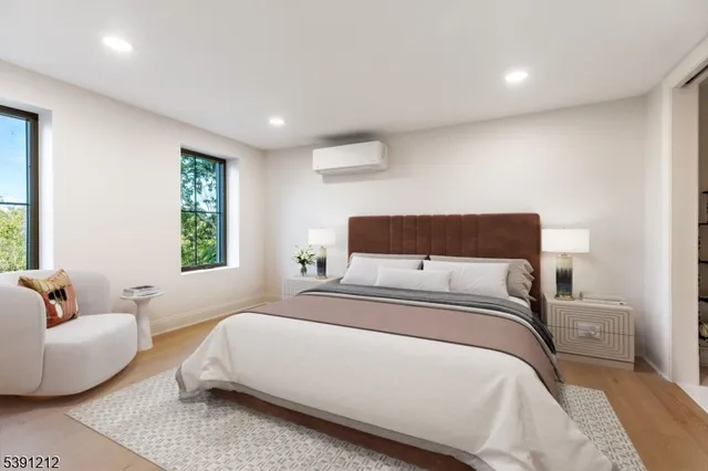 a bedroom with bed and window