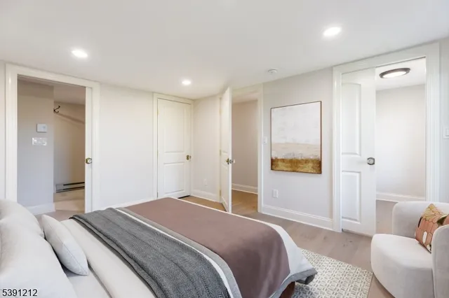 a bedroom with a bed and a couch