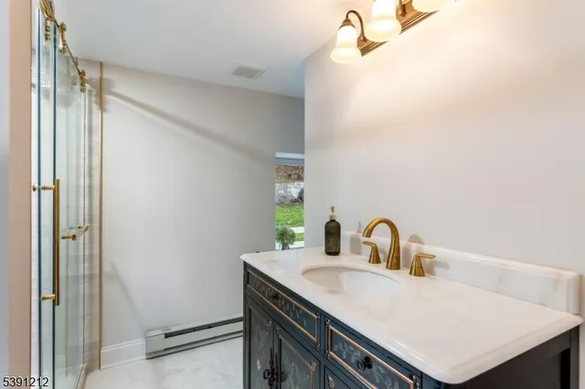 a bathroom with a sink and mirror