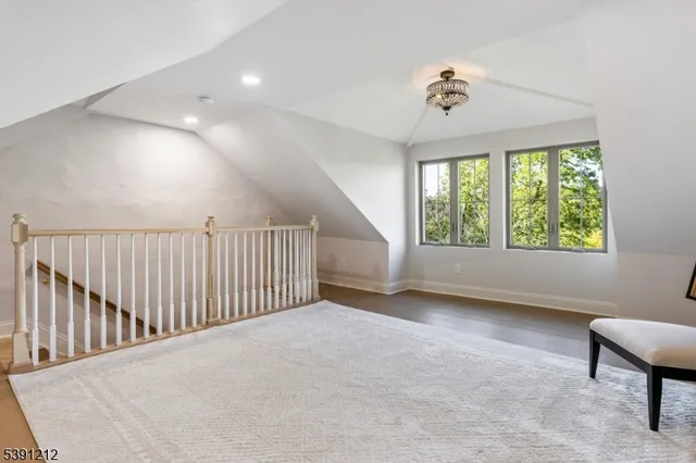 a view of a livingroom with a staircase and a fireplace