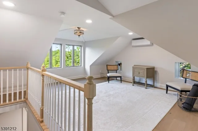 a view of a livingroom with furniture and a window