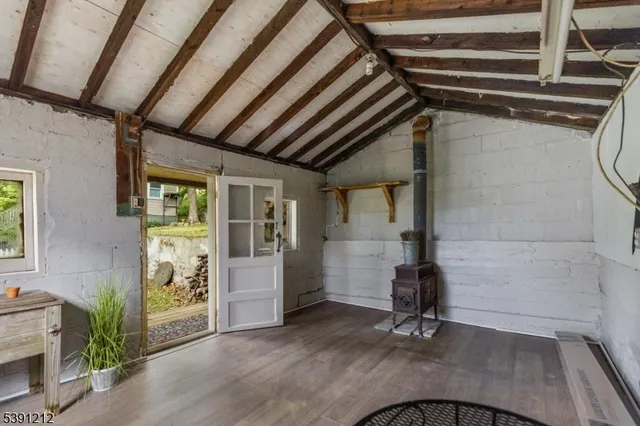 a room with gym equipment and a fireplace