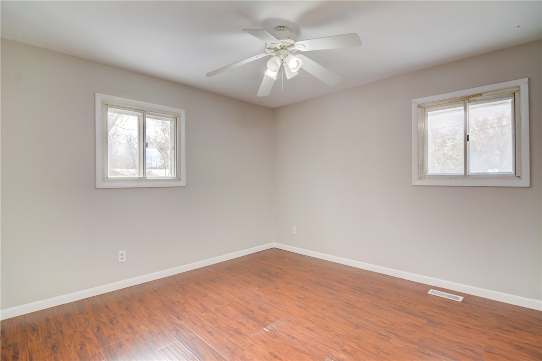 35 Whippoorwill Drive Decatur, IL 62526 - Photo 11 of 33 wooden floor in an empty room with a window