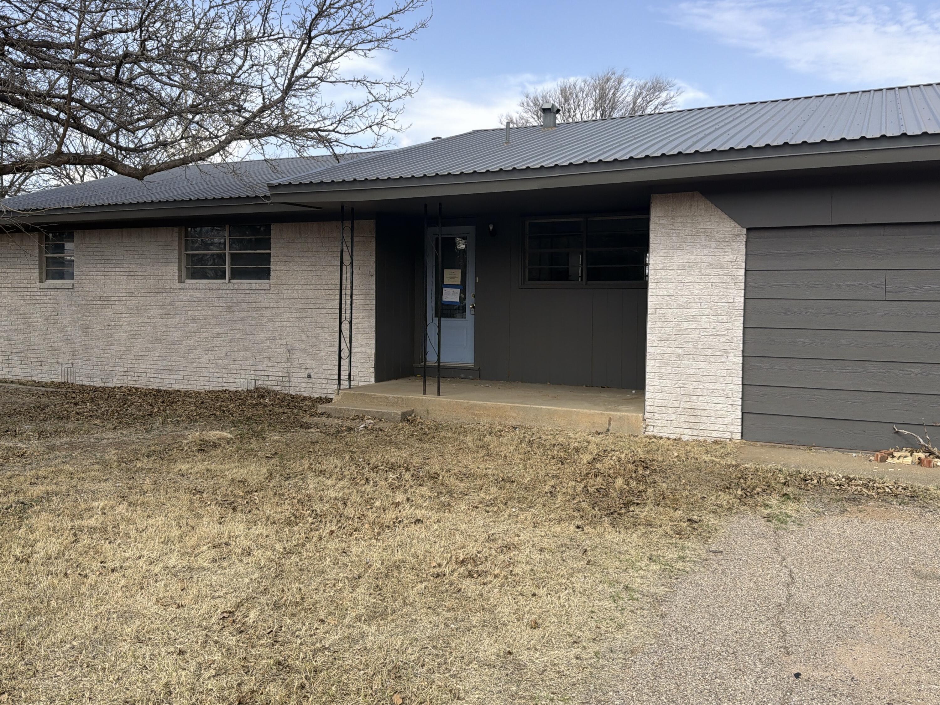 307 East 5th Street Sundown, TX 79372 - Photo 12 of 14 a front view of a house