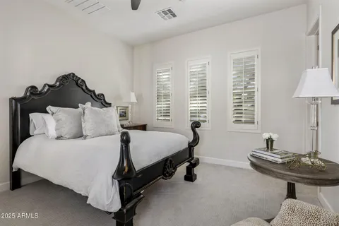 a bedroom with bed and a window