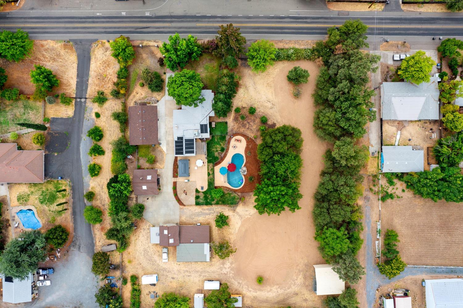an aerial view of a house with a yard and garden view